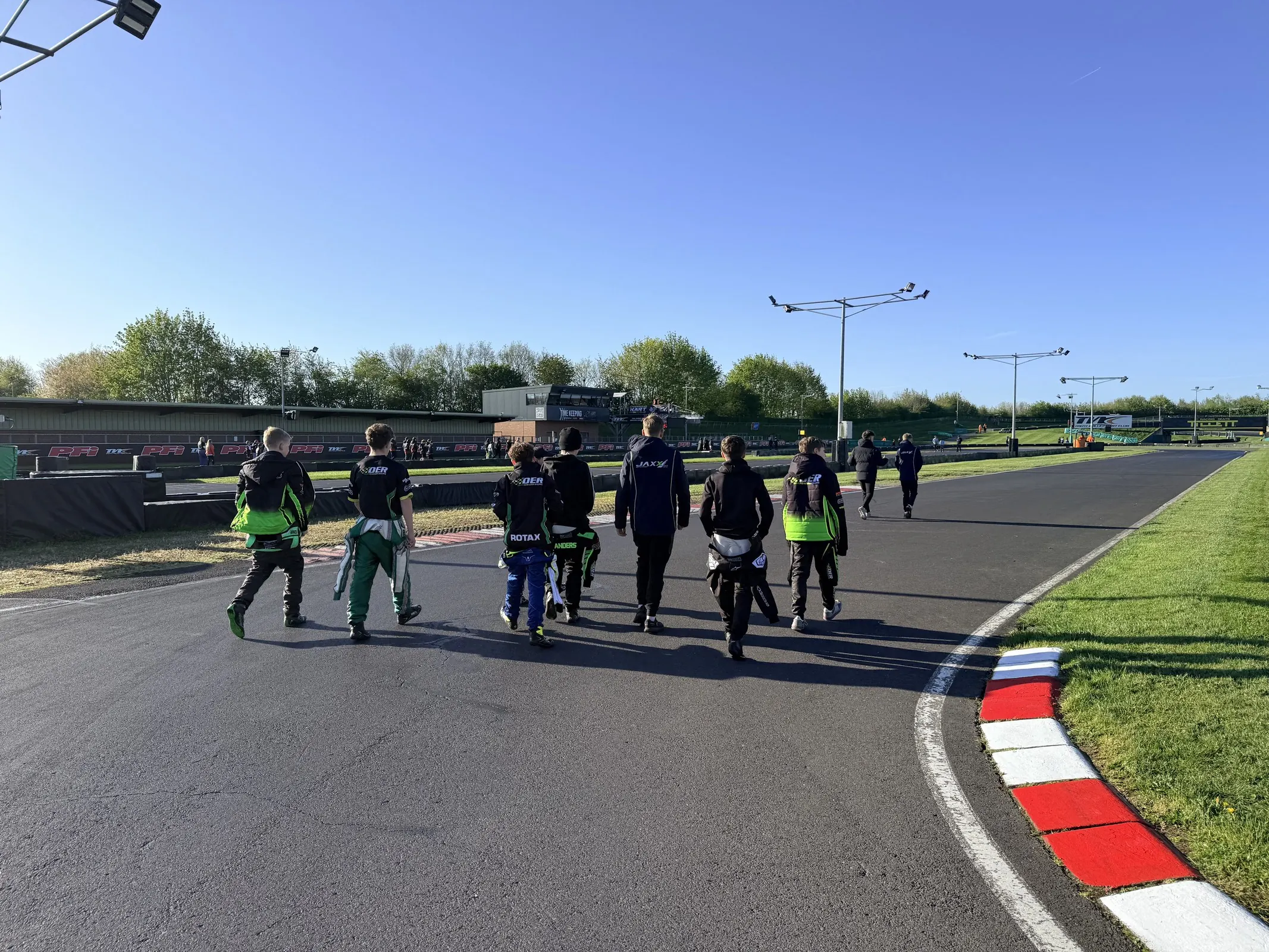 Drivers and team around the circuit